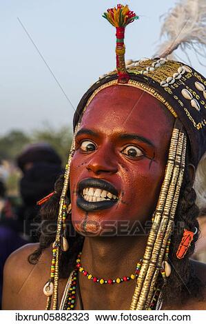 Wodaabe-Bororo man with face painted at the annual Gerewol festival, courtship ritual competition among the Fulani ethnic group, Niger, Africa View Large Photo Image Stock Image - Wodaabe-Bororo man with face painted at the annual Gerewol festival, courtship ritual competition among the Fulani ethnic group, Niger, Africa. Fotosearch