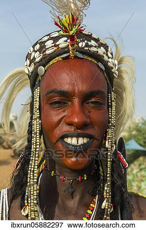 Wodaabe-Bororo man with face painted at the annual Gerewol festival, courtship ritual competition among the Fulani ethnic group, Niger, Africa View Large Photo Image Stock Photo - Wodaabe-Bororo man with face painted at the annual Gerewol festival, courtship ritual competition among the Fulani ethnic group, Niger, Africa. Fotosearch