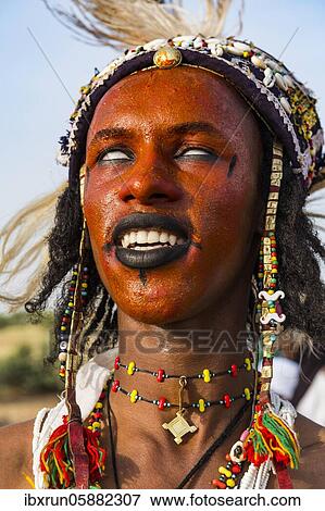 Wodaabe-Bororo man with face painted at the annual Gerewol festival, courtship ritual competition among the Fulani ethnic group, Niger, Africa View Large Photo Image Stock Photo - Wodaabe-Bororo man with face painted at the annual Gerewol festival, courtship ritual competition among the Fulani ethnic group, Niger, Africa. Fotosearch