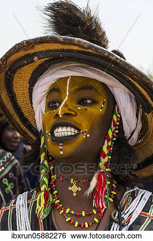 Wodaabe-Bororo man with face painted at the annual Gerewol festival, courtship ritual competition among the Fulani ethnic group, Niger, Africa View Large Photo Image Stock Photograph - Wodaabe-Bororo man with face painted at the annual Gerewol festival, courtship ritual competition among the Fulani ethnic group, Niger, Africa. Fotosearch