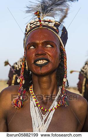 Wodaabe-Bororo man with his face painted at the annual Gerewol festival, courtship ritual competition among the Fulani ethnic group, Niger, Africa View Large Photo Image Stock Photo - Wodaabe-Bororo man with his face painted at the annual Gerewol festival, courtship ritual competition among the Fulani ethnic group, Niger, Africa. Fotosearch