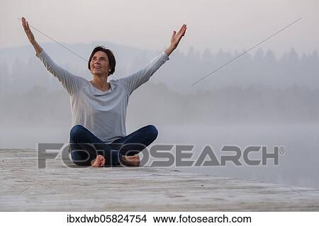 Woman at a jetty, life-affirming, positive, happy, meditating, praying, morning mood at Kirchsee, near Sachsenkam, Upper Bavaria, Bavaria, Germany, Europe View Large Photo Image Picture - Woman at a jetty, life-affirming, positive, happy, meditating, praying, morning mood at Kirchsee, near Sachsenkam, Upper Bavaria, Bavaria, Germany, Europe. Fotosearch