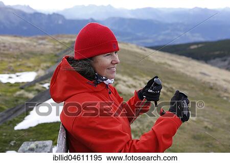 Stock Photography - Woman during Nordic Walking in the mountains, Rittner Horn, South Tyrol, Italy, Europe. Fotosearch