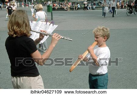 Stock Photo - Woman flute boy baguette, Berlin, Germany, Europe. Fotosearch