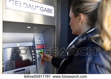 Woman introduces ec-card at the cash dispenser of a savings bank, Waiblingen, Baden-Württemberg, Germany, Europe View Large Photo Image Stock Image - Woman introduces ec-card at the cash dispenser of a savings bank, Waiblingen, Baden-Württemberg, Germany, Europe. Fotosearch