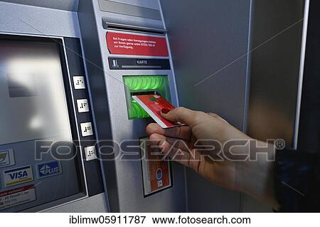 Woman introduces ec-card at the cash dispenser of a savings bank, Waiblingen, Baden-Württemberg, Germany, Europe View Large Photo Image Stock Photo - Woman introduces ec-card at the cash dispenser of a savings bank, Waiblingen, Baden-Württemberg, Germany, Europe. Fotosearch