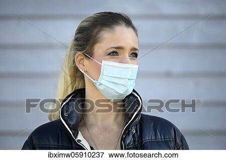 Stock Photo - Woman with face mask, portrait, corona crisis, Stuttgart, Baden-Württemberg, Germany, Europe. Fotosearch
