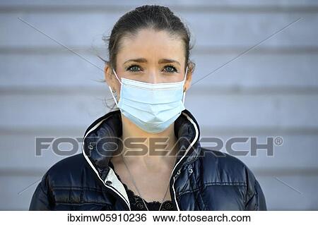 Stock Photograph - Woman with face mask, portrait, corona crisis, Stuttgart, Baden-Württemberg, Germany, Europe. Fotosearch