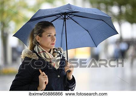 Woman with umbrella, serious look, portrait, Stuttgart, Baden-Württemberg, Germany, Europe View Large Photo Image Stock Photograph - Woman with umbrella, serious look, portrait, Stuttgart, Baden-Württemberg, Germany, Europe. Fotosearch