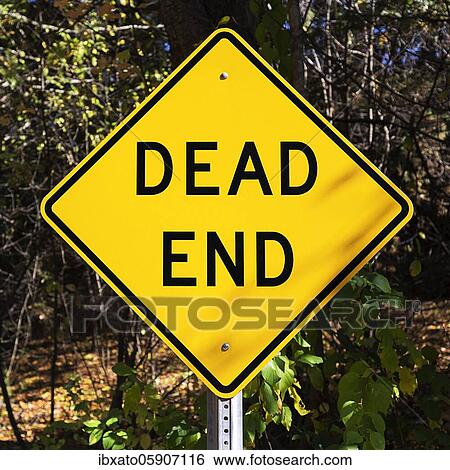 Yellow traffic sign for dead end, rhombic shape with the words Dead End in front of a forest, Maine, USA, North America View Large Photo Image Stock Photograph - Yellow traffic sign for dead end, rhombic shape with the words Dead End in front of a forest, Maine, USA, North America. Fotosearch