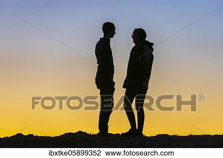 Young couple, twilight, talking, Baden-Württemberg, Germany, Europe View Large Photo Image Stock Image - Young couple, twilight, talking, Baden-Württemberg, Germany, Europe. Fotosearch