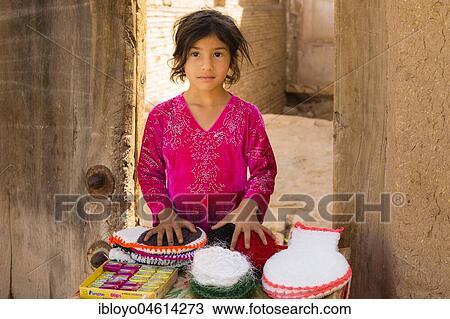 Young girl sells goods in the streets of Yazd, Iran, Asia View Large Photo Image Stock Image - Young girl sells goods in the streets of Yazd, Iran, Asia. Fotosearch