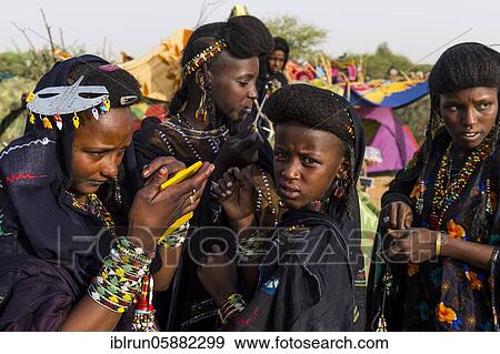 Stock Photo - Young girls at the Gerewol festival, courtship ritual competition among the Woodaabe Fula people, Niger, Africa. Fotosearch