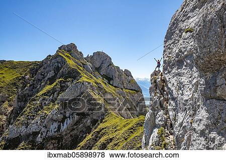 Young man stretches arms in the air, fixed rope route to the Seekarlspitze, 5-summit fixed rope route, hike at the Rofan Mountains, Tyrol, Austria, Europe View Large Photo Image Stock Photo - Young man stretches arms in the air, fixed rope route to the Seekarlspitze, 5-summit fixed rope route, hike at the Rofan Mountains, Tyrol, Austria, Europe. Fotosearch