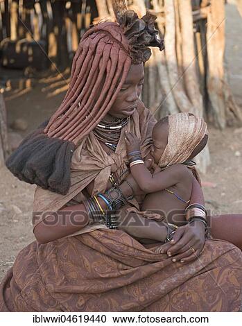 Young, married Himbafrau suckles injured infant, Kaokoveld, Namibia, Africa View Large Photo Image Stock Image - Young, married Himbafrau suckles injured infant, Kaokoveld, Namibia, Africa. Fotosearch
