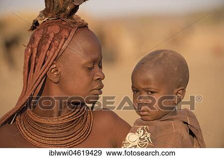 Stock Photo - Young, married woman with infant, portrait, Kaokoveld, Namibia, Africa. Fotosearch