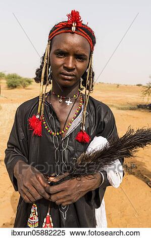 Stock Photography - Young peul man, Gerewol festival, courtship ritual competition among the Fulani ethnic group, Niger, Africa. Fotosearch