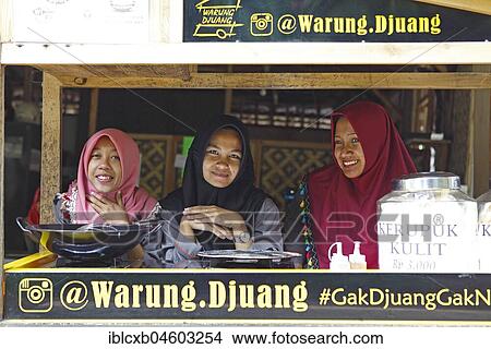 Picture - Young women with headscarf, locals in Warung, Malang, Java, Indonesia, Asia. Fotosearch