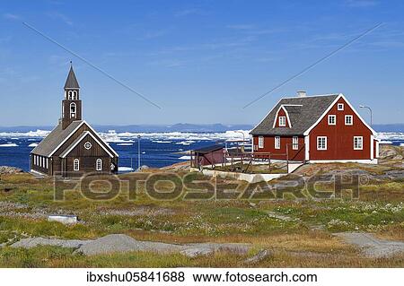 Stock Photo - Zion Church and colourful wooden houses, Disko Bay, Ilulissat, West Greenland, Greenland, North America. Fotosearch