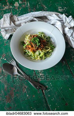 Stock Image - Zucchini pasta with lentils. Fotosearch