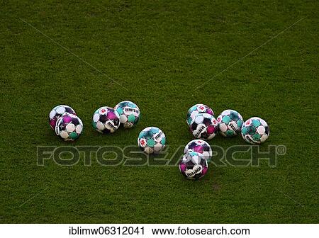 Stock Image - 11 match balls adiadas Derbystar, lying on grass, Mercedes-Benz Arena, Stuttgart, Baden-Württemberg, Germany, Europe. Fotosearch