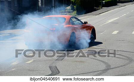 A car burning tire on a street, Rydsgård, Scania, Sweden, Europe View Large Photo Image Stock Image - A car burning tire on a street, Rydsgård, Scania, Sweden, Europe. Fotosearch