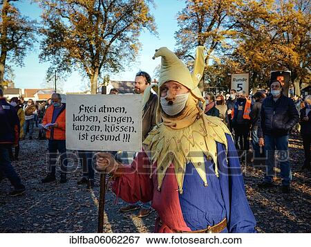 A man dressed as a joker with a Hitler beard, demonstration against corona measures of the Querdenken-Bündnis on 14. 11. 2020 in Schrobenhausener Straße, Aichach, Bavaria, Germany, Europe View Large Photo Image Stock Photo - A man dressed as a joker with a Hitler beard, demonstration against corona measures of the Querdenken-Bündnis on 14. 11. 2020 in Schrobenhausener Straße, Aichach, Bavaria, Germany, Europe. Fotosearch