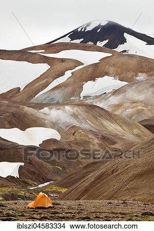 A tent on a snow-covered rhyolite mountain, high temperature area Hveradalir, Kerlingarfjöll, Island View Large Photo Image Picture - A tent on a snow-covered rhyolite mountain, high temperature area Hveradalir, Kerlingarfjöll, Island. Fotosearch