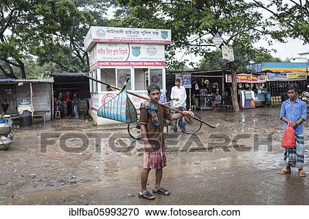 Ahmed, seeks lost valuables for a fee, at the bus station in Mongla, Sundarbans, Bangladesh, Asia View Large Photo Image Stock Image - Ahmed, seeks lost valuables for a fee, at the bus station in Mongla, Sundarbans, Bangladesh, Asia. Fotosearch