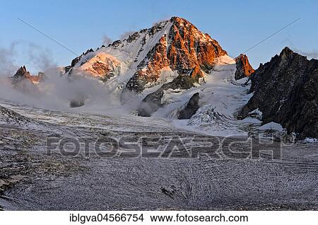 Aiguille du Chardonnet peak in fog over the glacier Glacier du Tour, evening light, Chamonix, Savoy, France, Europe View Large Photo Image Picture - Aiguille du Chardonnet peak in fog over the glacier Glacier du Tour, evening light, Chamonix, Savoy, France, Europe. Fotosearch