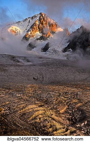 Aiguille du Chardonnet peak in fog over the glacier Glacier du Tour, evening light, Chamonix, Savoy, France, Europe View Large Photo Image Stock Image - Aiguille du Chardonnet peak in fog over the glacier Glacier du Tour, evening light, Chamonix, Savoy, France, Europe. Fotosearch