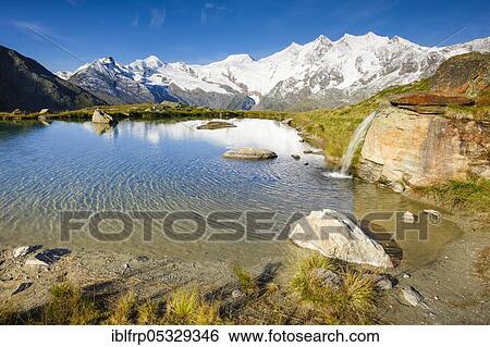 Stock Photograph - Allalinhorn, 4027m, Alphubel, 4206m, Täschhorn, 4491m, Dom, 4545m, Valais, Switzerland, Täschhorn, Europe. Fotosearch