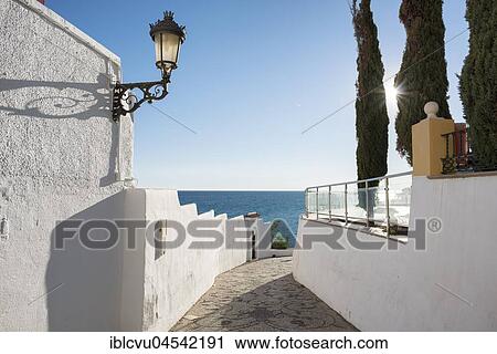 Stock Image - Alley with sea view, Nerja, Andalusia, Costa del Sol, Spain, Europe. Fotosearch