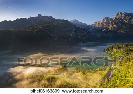 Stock Photo - Almsee im Nebel, Totes Gebirge, Almtal, Salzkammergut, Upper Austria, Austria, Europe. Fotosearch