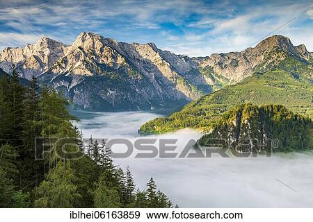 Stock Photo - Almsee im Nebel, Totes Gebirge, Almtal, Salzkammergut, Upper Austria, Austria, Europe. Fotosearch
