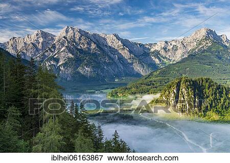 Stock Photo - Almsee im Nebel, Totes Gebirge, Almtal, Salzkammergut, Upper Austria, Austria, Europe. Fotosearch