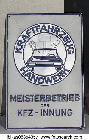 Stock Photo - Altes KFZ Meisterschild, master workshop of the automobile guild, Kraftfahrzeug Handwerk, Düsseldorf, North Rhine-Westphalia, Germany, Europe. Fotosearch