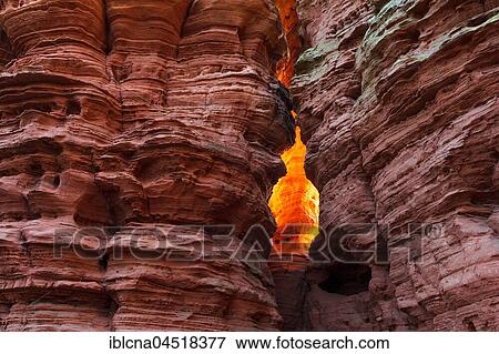 Stock Photo - Altschlossfelsen glowing orange-red through the inciding sun, sandstone, Eppenbrunn, Rhineland-Palatinate, Germany, Europe. Fotosearch