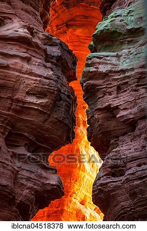 Stock Photo - Altschlossfelsen glowing orange-red through the inciding sun, sandstone, Eppenbrunn, Rhineland-Palatinate, Germany, Europe. Fotosearch