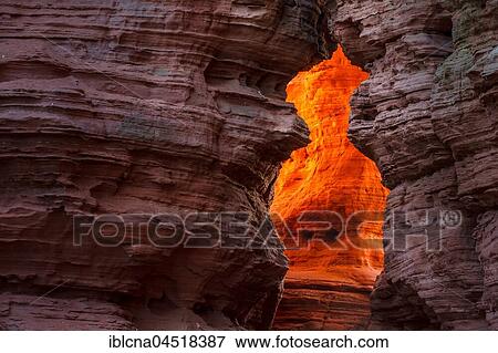 Stock Photo - Altschlossfelsen glowing orange-red through the inciding sun, sandstone, Eppenbrunn, Rhineland-Palatinate, Germany, Europe. Fotosearch