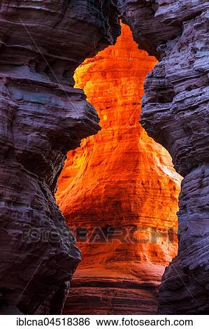 Stock Photograph - Altschlossfelsen glowing orange-red through the inciding sun, sandstone, Eppenbrunn, Rhineland-Palatinate, Germany, Europe. Fotosearch