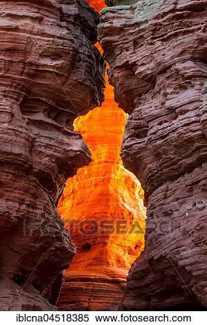 Stock Photography - Altschlossfelsen glowing orange-red through the inciding sun, sandstone, Eppenbrunn, Rhineland-Palatinate, Germany, Europe. Fotosearch