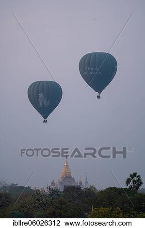 Stock Image - Ananda Temple with two blue balloons, Old Bagan, Myanmar, Asia. Fotosearch