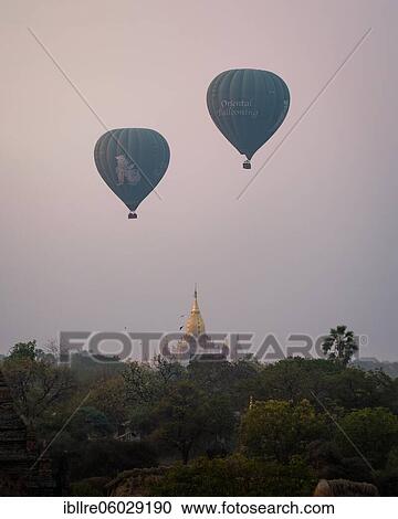 Stock Image - Ananda Temple with two blue balloons, Old Bagan, Myanmar, Asia. Fotosearch