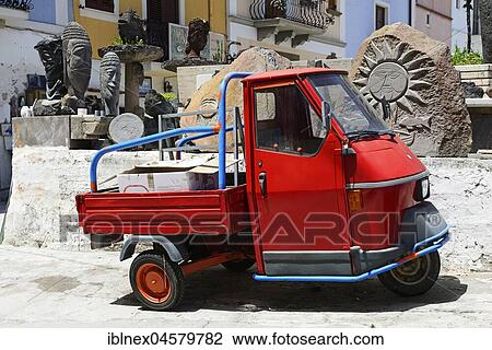 Ape-Tricycle in front of Obsidian Sculptures, Lipari, Lipari Islands, Italy, Europe View Large Photo Image Stock Image - Ape-Tricycle in front of Obsidian Sculptures, Lipari, Lipari Islands, Italy, Europe. Fotosearch