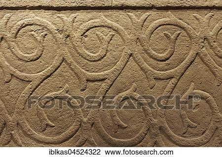 Stock Image - Architectural fragment with ornaments, prehistoric Temple of Hal Tarxien, Archaeological Museum, Valletta, Malta, Europe. Fotosearch