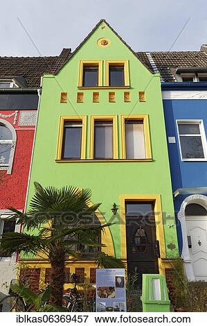 Stock Photo - Art Nouveau row of houses with coloured facades, Düsseldorf-Holthausen, North Rhine-Westphalia, Germany, Europe. Fotosearch