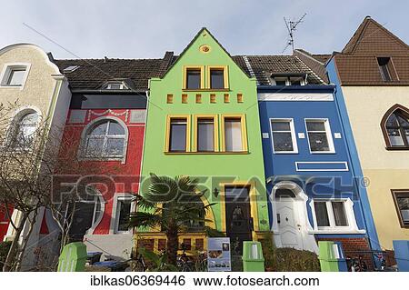Stock Photograph - Art Nouveau row of houses with coloured facades, Düsseldorf-Holthausen, North Rhine-Westphalia, Germany, Europe. Fotosearch