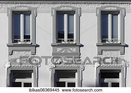 Stock Photography - Art Nouveau stucco façade with windows, residential house built in 1909, Düsseldorf, North Rhine-Westphalia, Germany, Europe. Fotosearch