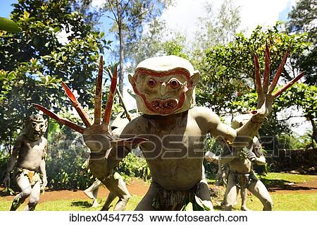 Stock Image - aThe mudmen of Asaro with their martial masks of clay, Goroka, in the highlands of Papua New Guinea. Fotosearch